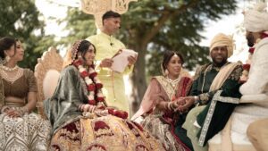 Traditional Indian wedding ceremony with bride, groom, and family members.