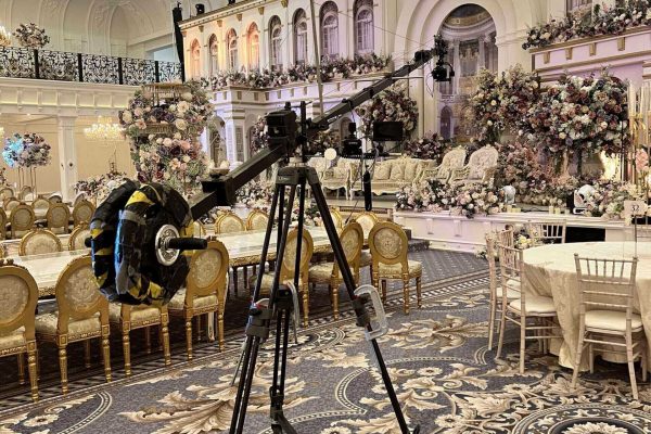 Elegant event setup with a professional camera on tripod.